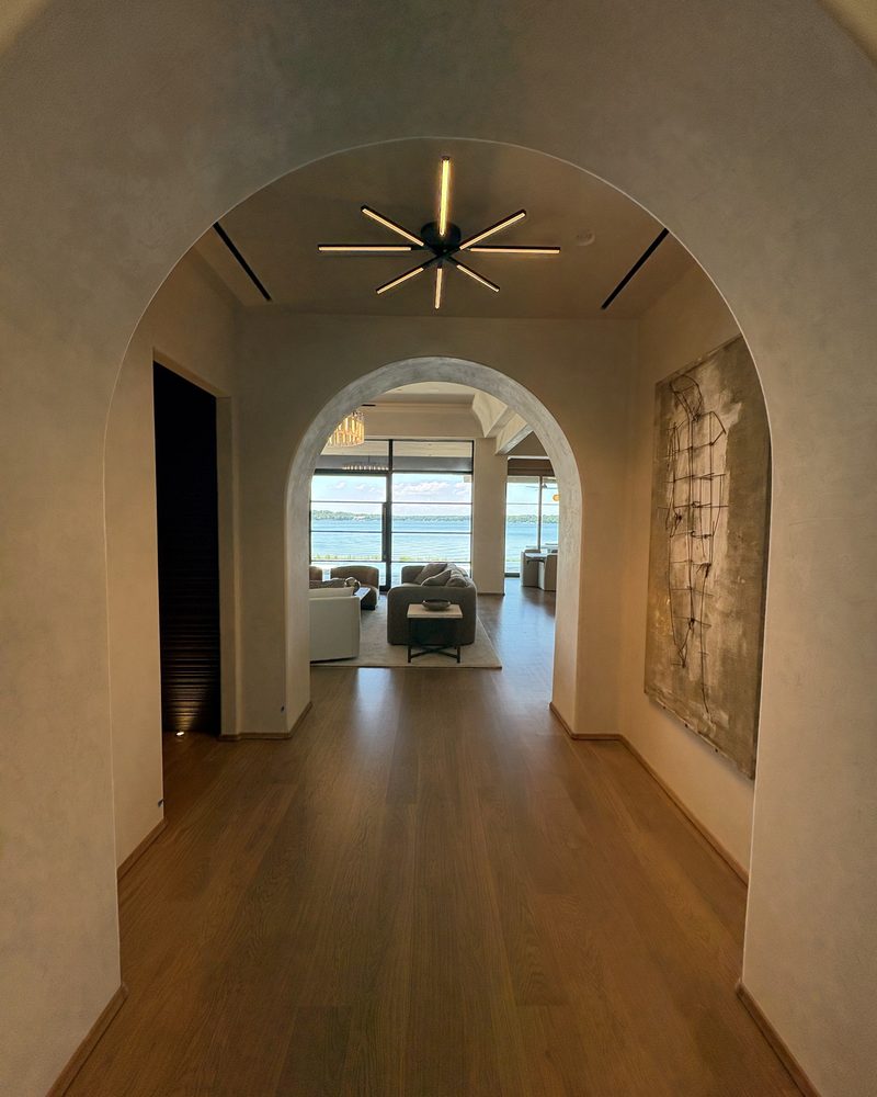 An arched hallway in Lime Plaster Fine.