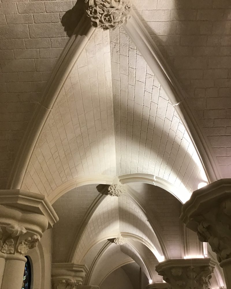 Vault ribs and carved capitals in Stonecoat.