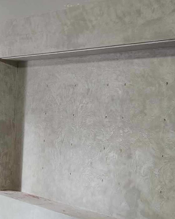 A wall with deep niches in Lime Plaster Medium.
