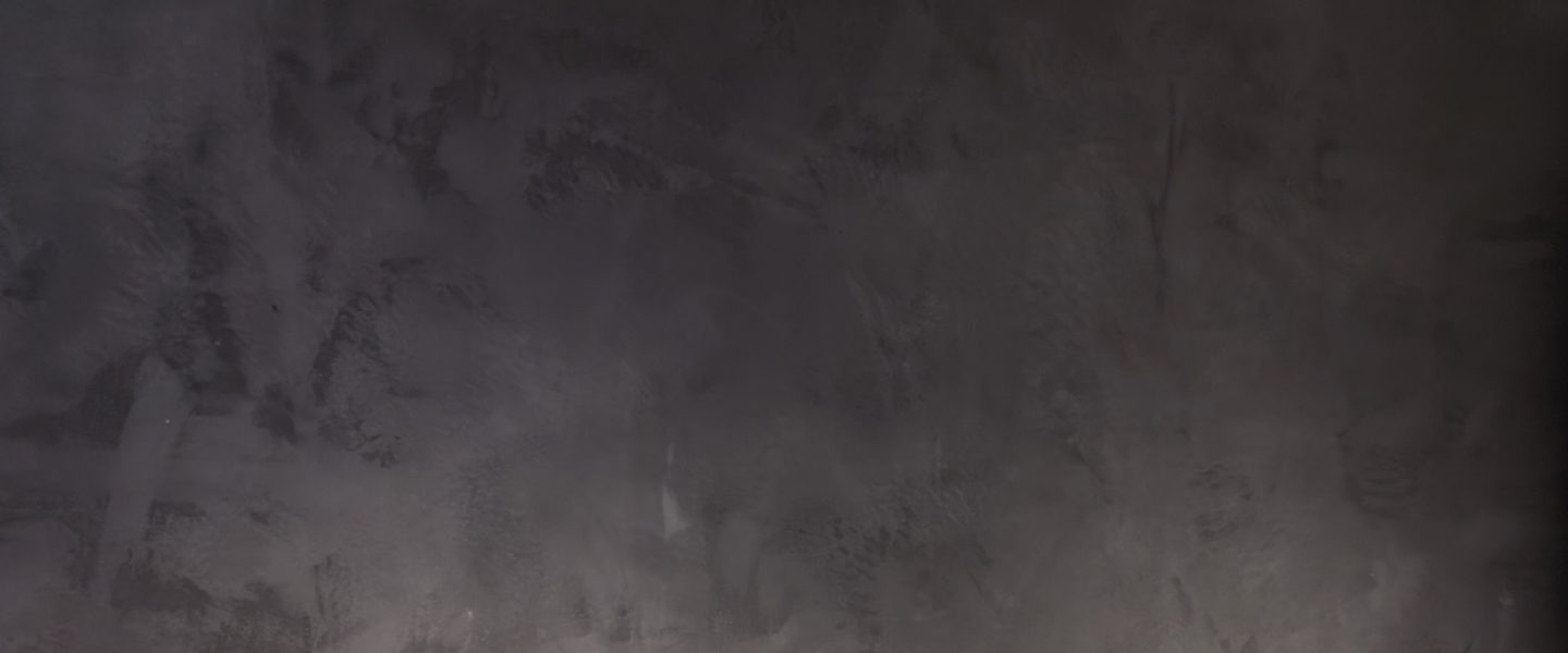 A dark polished grey surface.